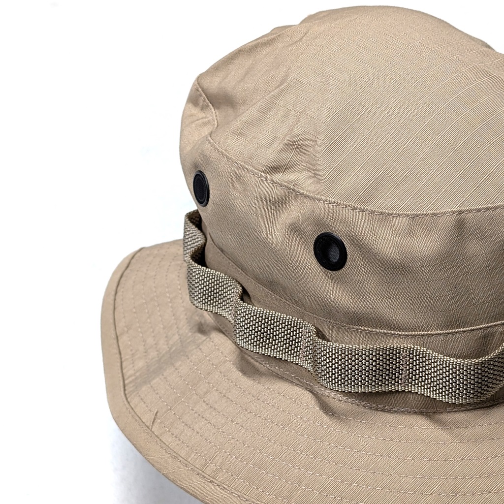 close up of the brim, branch loops, and grommets on a tan sun hat