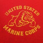 a red US Marine Corps shirt with bulldog mascot