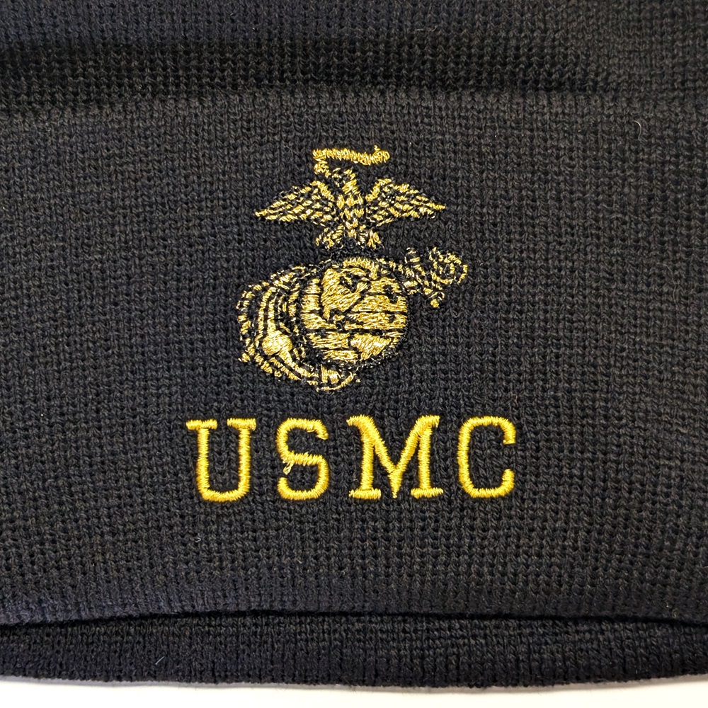 USMC and a Marine Corps EGA embroidered with gold thread on a black beanie