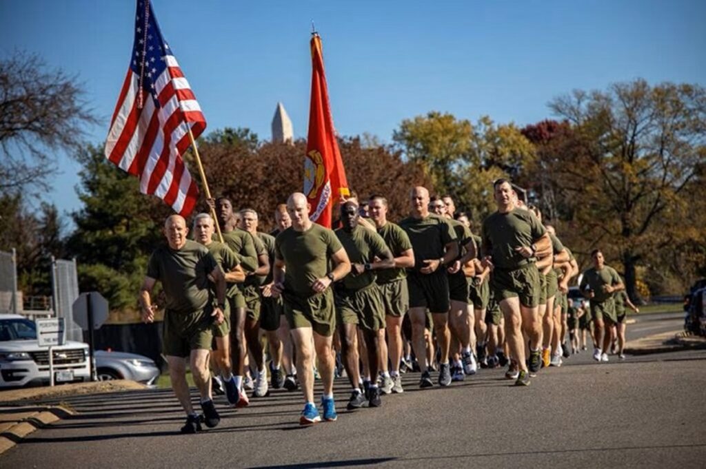 Marines in pt gear on a moto run celebrating the Marine Corps birthday