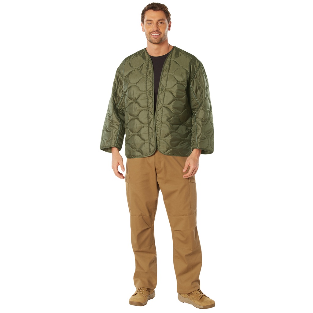 man wearing an olive drab military field jacket liner