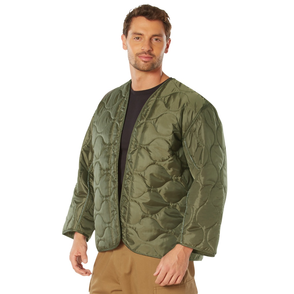 man wearing an olive drab military field jacket liner