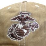 a coyote brown US Marine Corps baseball hat with an embroidered EGA
