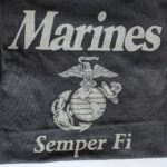 a black Marines pt shirt with reflective gray print