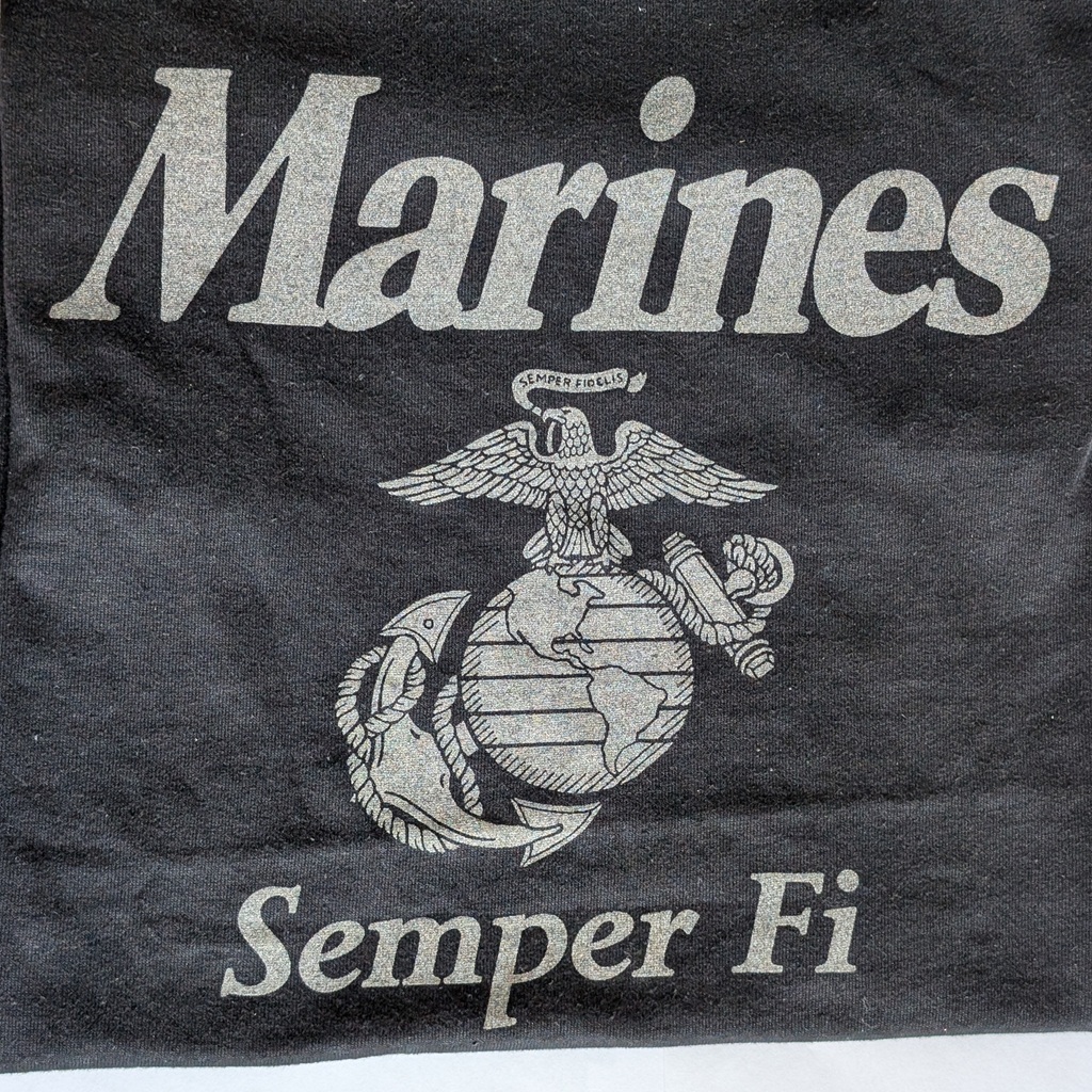 a black Marines pt shirt with reflective gray print