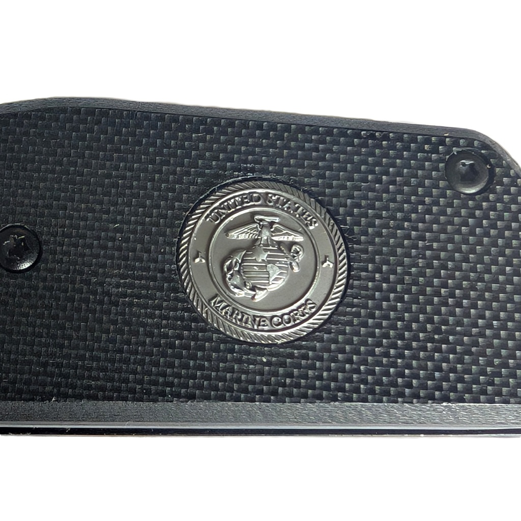 a black, spring-assisted US Marine Corps pocket / rescue knife