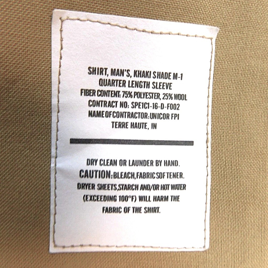 a short sleeve US Marine Corps khaki service uniform dress shirt