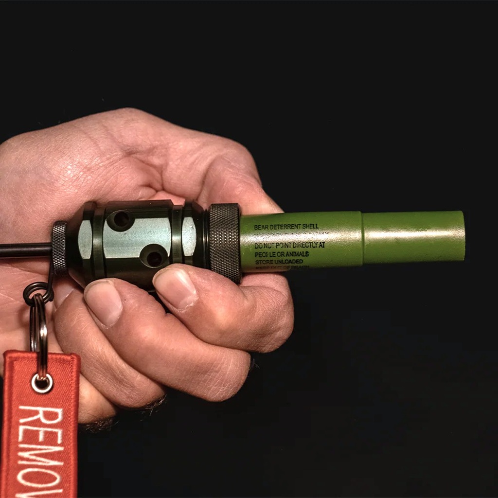 a trip and rescue alarm kit with bear deterrent blanks and flares