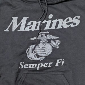 a black Marine Corps hoodie with reflective print: "Marines" "Semper Fi" and an Eagle, Globe, & Anchor