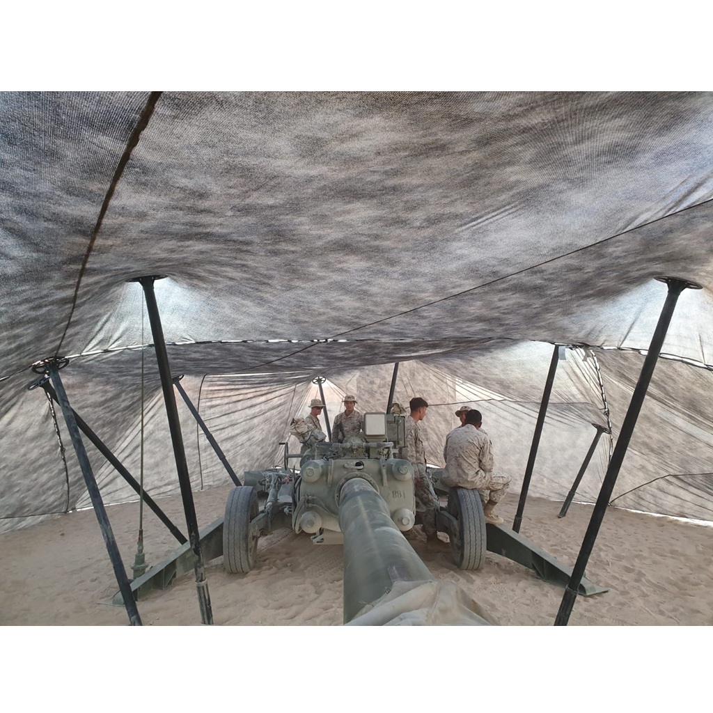 US Marines under camo netting