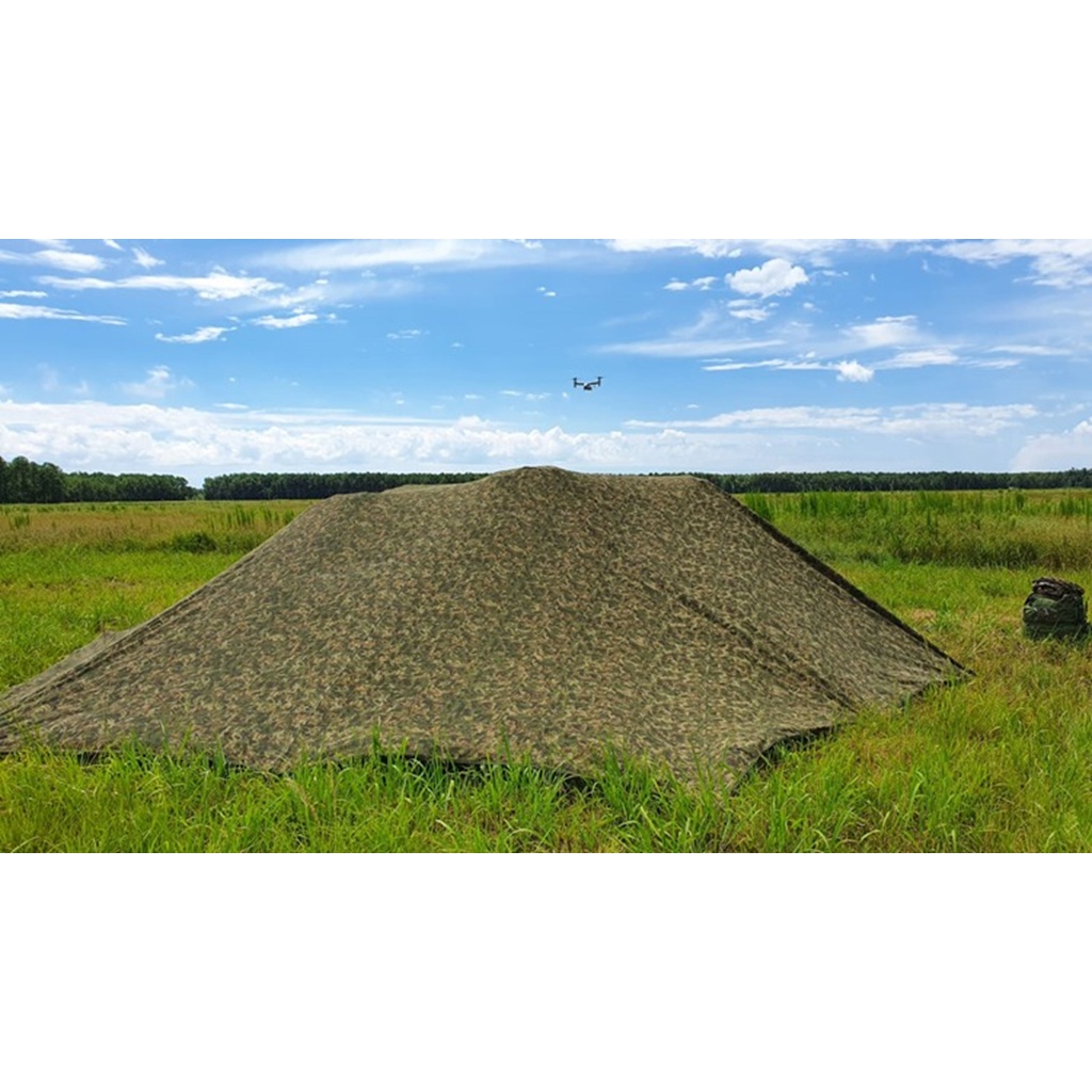 a camo net hiding from drone